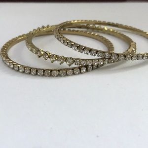 Set of three gold diamond studded bracelets